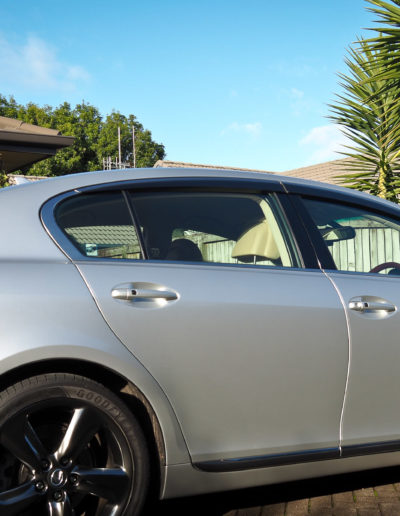 Full right side image of the car in the sun after coating applied.