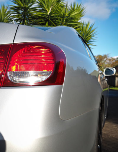 Right rear bumper and side with deep gloss and reflections on paintwork