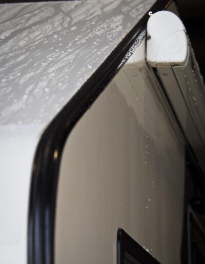 Close up of water running off roof with ceramic coating